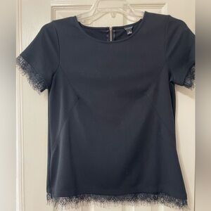 Ann Taylor black top with lacey fringe.